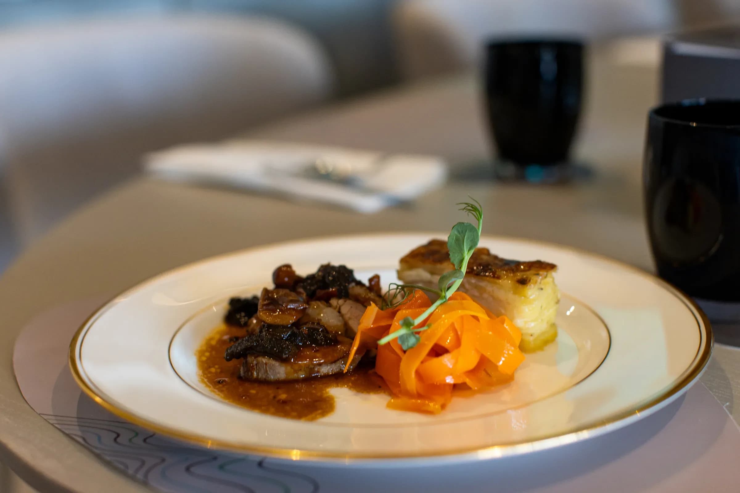 Plated fine dining course in a hospitality suite