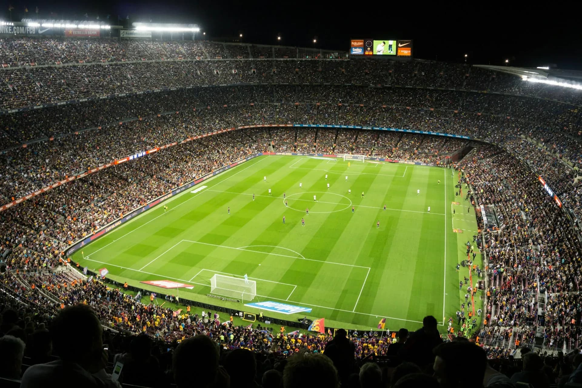 The Camp Nou under floodlights during a match