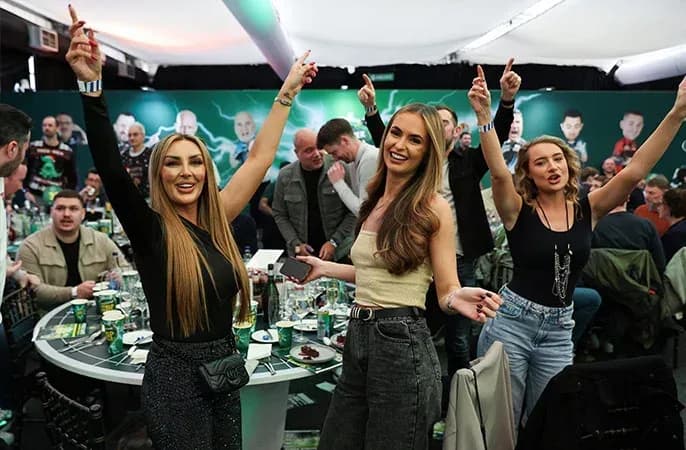 Guests celebrating in darts hospitality