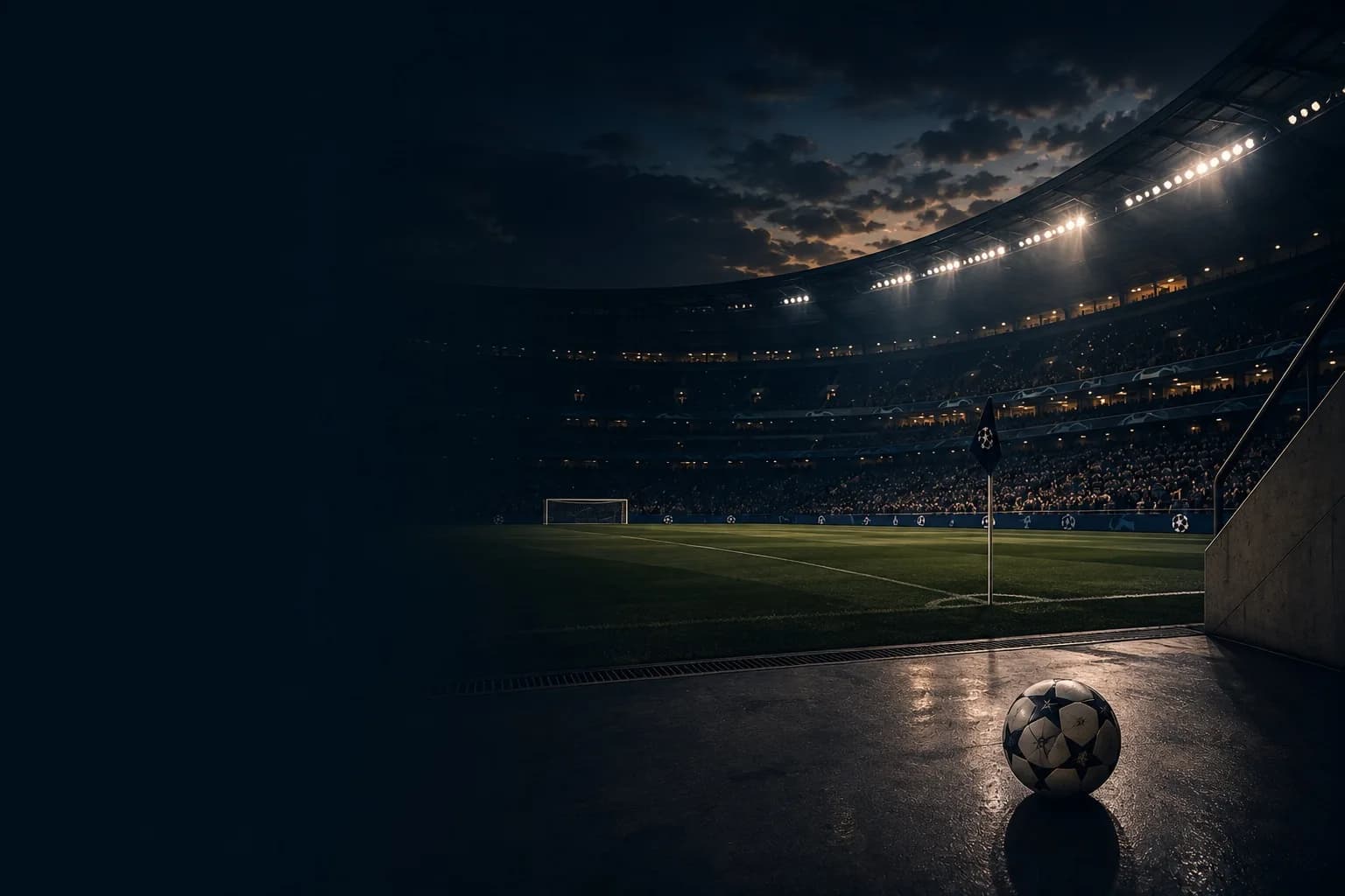 A football stadium under floodlights at night
